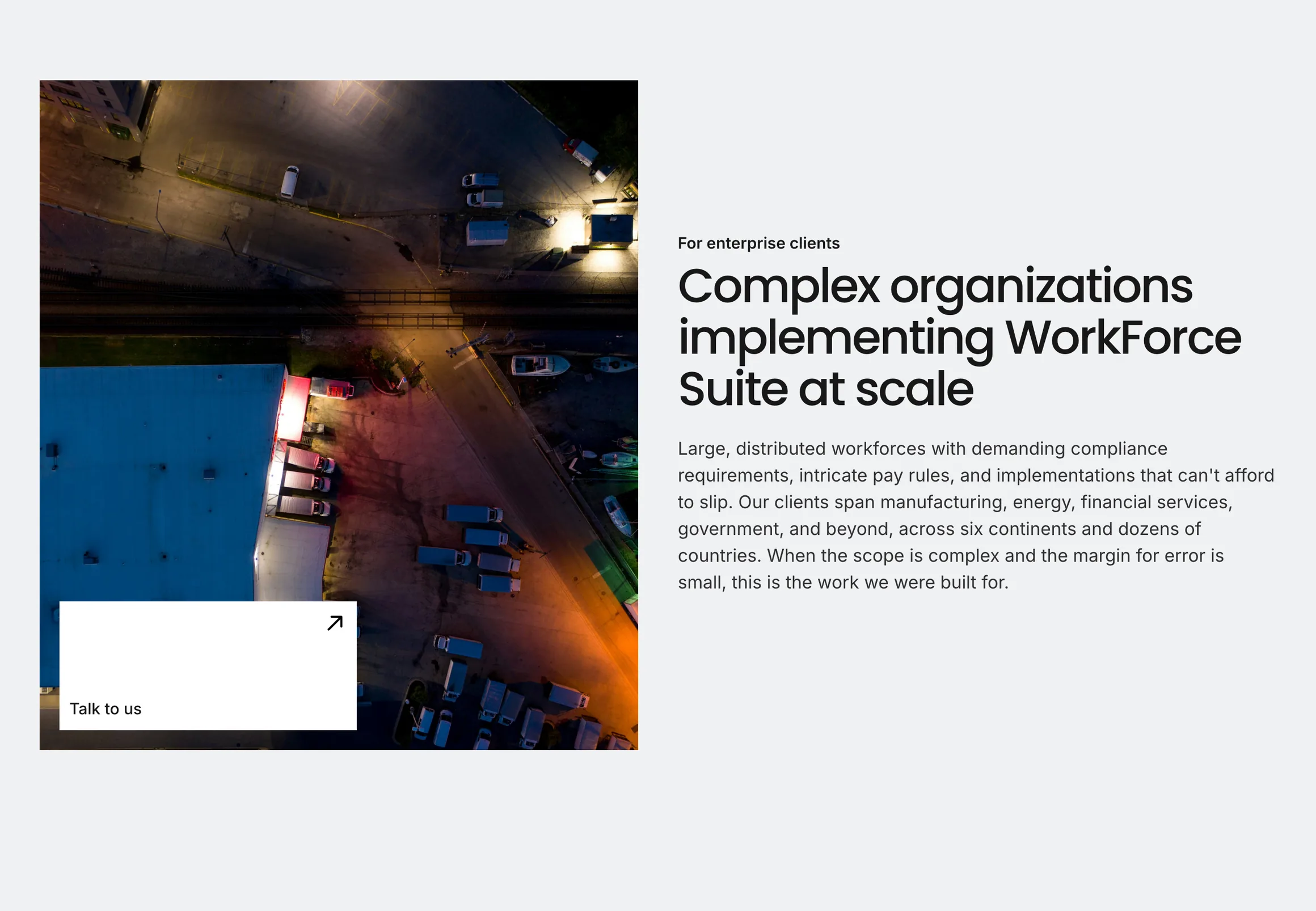 The For enterprise clients row on the Who We Work With page: an aerial photo with a Talk to us card beside the heading Complex organizations implementing WorkForce Suite at scale